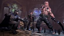 Batman fighting some goons in Batman: Arkham City 