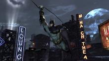 Batman using his grappling hook in Batman: Arkham Origins 