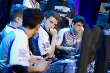 Players strategizing during Heroes of the Dorm match