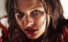 Milla Jovovich's character can be considered as a representation of the people who don't play the Resident Evil video games.